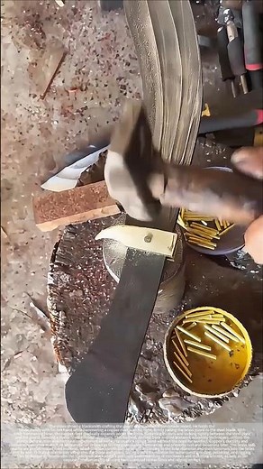The blacksmith's precise strike: cold-riveting copper nails to create a perfect knife guard