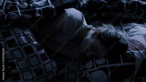 Young Woman sleeping in bed at night