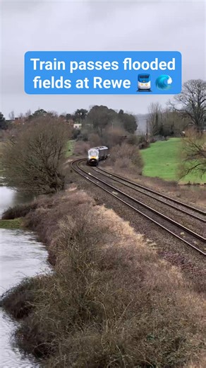 🚆🌊 TRAIN PASSES FLOODED FIELDS AT REWE 🚆🌊 A GWR passenger train passes flooded fields at Rewe, near Exeter, today. The 2.52pm service from Exeter St Davids to Cardiff Central is shown approaching Columbjohn Overbridge just before 3pm. The River Culm had overtopped, flooding nearby fields and leaving the road to Killerton impassable for most vehicles. The floodplain has been restored in this area to boost the natural environment. A flood alert has been issued for the Culm and Clyst rivers and