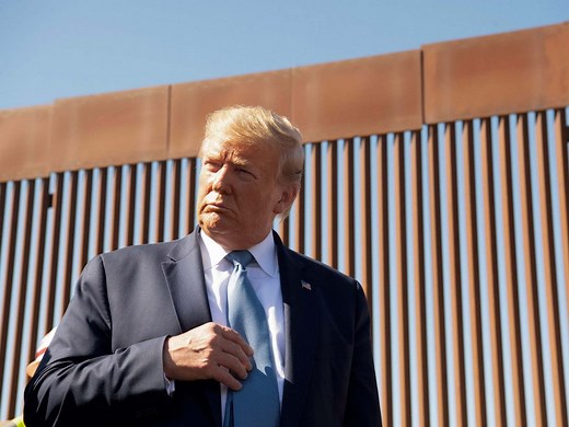 Video shows people scaling border wall in seconds - despite Trump insisting it 'can't be climbed'