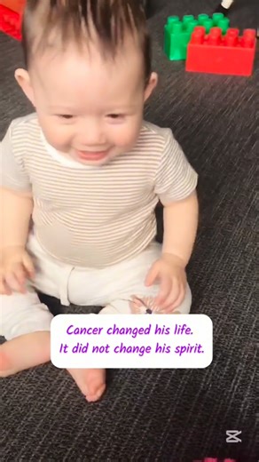 Momma Jo on Instagram: "Joe’s world now includes hospital halls, treatment days, medications, and words no toddler should have to learn. His routine looks different. His body changes. His childhood has been interrupted. 🎗️ But his joy? Still there. His curiosity? Still alive. His cheeky smiles, waves to strangers, and love for life? Unchanged. ✨ Even on the hardest days, Joe shows us what courage looks like in its purest form. Not loud. Not dramatic. Just steady, resilient, and full of heart. ❤