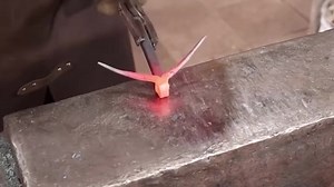 Blacksmith forges longhorn steer hook