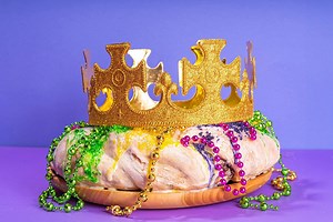 Here’s the colorful history behind the Mardi Gras king cake—and its hidden prize