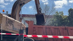 Backhoe working. Crawler excavator digging on soil. Excavation vehicle.
