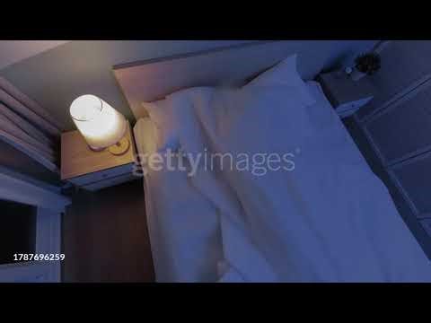 Time Lapse Top View of Unhappy Woman with Insomnia Lying on Bed at Night