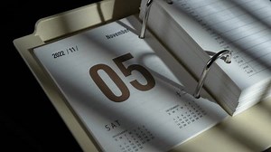 A closeup timelapse video of the changing dates in 2023 paper calendar