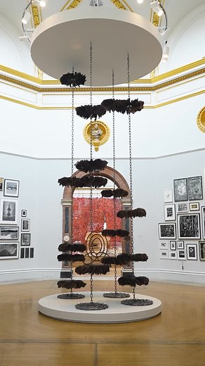 100m of heavy stainless steel chains and plumes of ostrich feathers decorate the central hall ⛓️🪶 Alice Channer tells us the inspiration behind her suspended artwork ‘Body Shop’. See it for yourself in the Summer Exhibition ☀️ | Royal Academy of Arts