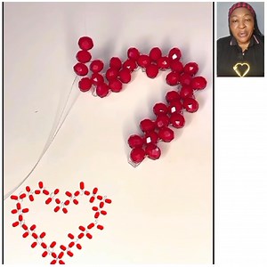 DIY: Beaded Heart ♥️ This Christmas, let your beaded hearts be a beacon of light and love. Whether you're crafting them as gifts for loved ones or as decorations for your home, each piece carries a piece of your heart. The act of creating these beautiful ornaments is a reminder of the joy that comes from giving and the beauty of handmade treasures. Happy beading! 🎥 Design by: @kharz_w_lolii #lovebeads #beadedornament #handmadesnowflake #CraftingMagic #beadedheart #beads #beaded #beading #beadin