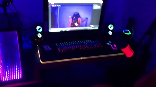 Stylish Gaming Setup with RGB Lighting and MX5 Chair