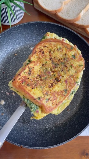 Shenaz | Food | Easy Recipes | YYC 🇨🇦 Canada on Instagram: "Spicy Egg Sandwich 📌 . Algorithm Check ✅ What went in ⬇️ 3 eggs 🥚 2 tbp chopped onions 1 chilli Chopped coriander 1/4 tsp turmeric Salt as needed 2 tbsp milk Oil/ butter to fry Bread slices 2 1/2 tsp chilli flakes 1/2 tsp oregano 1 slice cheese ( add more if you like or leave it out if you don’t) Oil to fry #brunchideas #frenchtoast #eggsandwich #indianfood #breakfastrecipes #canada #eggrecipes #brunch"