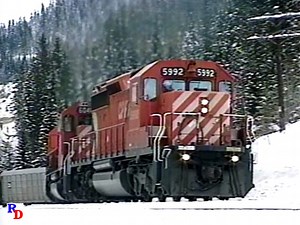 Two Canadian Pacific freights are seen at the famous Spiral Tunnels on Kicking Horse Pass. From the Highball Productions show "Winter on Kicking Horse Pass" https://rfd.video/KHP | Railfan Depot