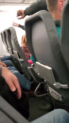 Frontier Airlines Incident: Woman Aided by Nurse Confronted by Flight Attendant