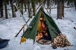17K views · 390 reactions | Creating Two Types of Finnish Torches while Camping in a 4K Winter Hot Tarp Poncho Shelter on Deer Skin | Bushcraft Survival Man | Facebook