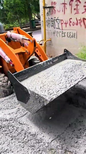 Compact Loader Leveling Wet Concrete – Satisfying Road Construction Process