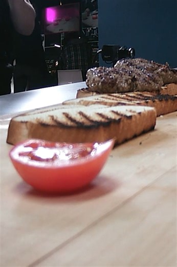 Classic Louis Lunch burger cooked on cast iron grill