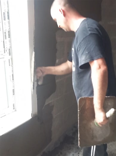 plasterer applies sand and cement plaster to concrete block walls on new build walls will be coated strightened floated and keyed no lime on this 1 will be cement and gypsum on the walls n celings #PlasteringWork #tiktokplastering #plasteringlife #fypconstruction #cement more can be seen our u tube channel mac plastering