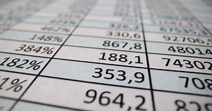 Paper table with numbers and financial indicators closeup 4k movie. Statistics and audit concept