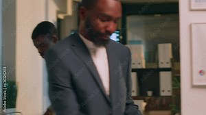 Employees working together on finishing project before impending deadline, auditing financial payroll reports in office during nightshift. Teamworking colleagues brainstorming ideas at work