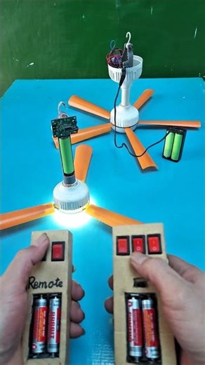 Two ceiling fans with two remote controls.