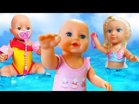 Baby Annabell doll & kids pretend play baby dolls at the beach. Baby doll morning routine & toys