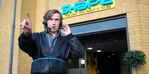 Alan Partridge singing in his car - Alan Partridge: Alpha Papa - British Comedy Guide