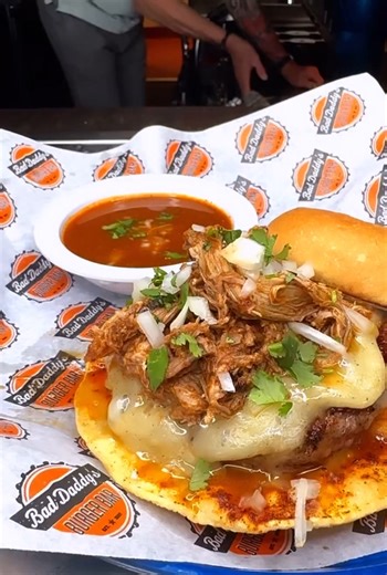 We’re kicking off Burger Month with the new Birria Burger! Daddy’s spin on these famous tacos include hand-pulled pork slow-simmered in warm consommé, Monterey jack, & a fried corn tortilla. It’s only here for a limited time! | Bad Daddy's Burger Bar