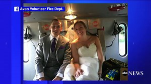 Bride and groom ride to reception with fire department after wedding bus fire