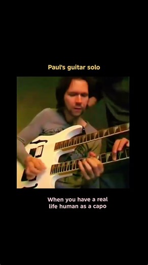 Paul Gilbert amazing guitar solo with a real human as a capo