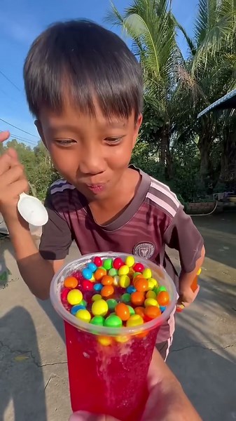 Many kinds of rainbow-colored candies and red syrup cups #shorts