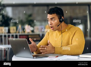 Worried employee having a problem with internet connection while important video meeting. Confused male manager sit at the desk, using computer, upset about work issues Stock Photo - Alamy