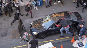 George Floyd protests: Video shows chaos in Seattle after man armed with gun drives car into crowd