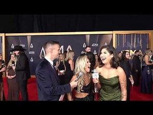 At CMA Award's red carpet, Mackenzie Carpenter teases a 'heartbreaker' single and Riley Green tour