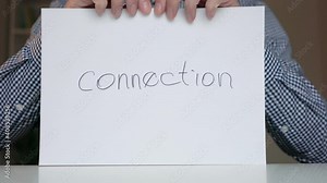 a person breaks a paper sheet with the word connection. breaking the connection