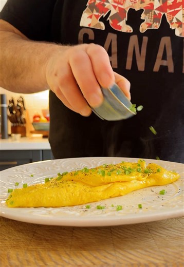 The French omelette… looks simple but requires a bit of technique! I’ve heard that some chefs will actually test a new cook by asking them to cook a French omelette because it’s easy to get it wrong. I have zero interest in working at a restaurant, but I love practicing cooking techniques and improving as a home cook. A French omelette is one of my favourite types of omelette… it feels a fancy and tastes amazing. Creamy, fluffy, and yes… full of butter. I even added extra at the end for that glo