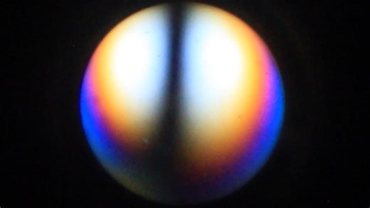 forsterite in thin section FKM-459 optic axis figure