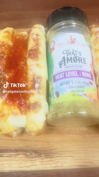 I call this the lazy man's meatball sub. Didn't feel like going to the store and don't have any rolls, so toasted hot dog buns it is. Cheated and used sauce from a jar and added some Shore Smoke Seasonings That's Amore. Topped with a new hot sauce and lets just say I'm in LOVE with it. Laying on an Ed’s Shape Shack board. #shoresmokeseasonings #tailgatetastingtour #truesmokebbq #edsshapeshack