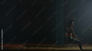 Professional long jumper in slow motion at competitions runs on a treadmill and jumps in the sand