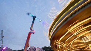 Time lapse of fairground rides at dusk at Goose Fair, Forest Fields, Nottingham, Nottinghamshire. England