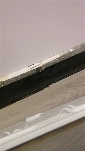 flooring molding installation using silicon.