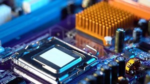 Engineer repairman holding hands in black gloves chip processor, CPU to insert into the socket of the computer motherboard. The concept of technology hardware and repair in the neon light