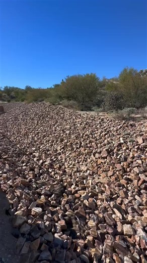 Installing rip rap for erosion control is often also installing a rattlesnake den. These piles of rock are perfect thermoregulatory opportunities, and won't go unnoticed by rattlesnakes and other reptiles. Here's one that Jeff ran into while putting together a Rattlesnake Fence estimate today. Some tips while installing rip rap to help reduce the chances of it becoming a rattlesnake den: - Use smaller rocks of relatively uniform size if possible. Avoid larger boulders (larger than a cantaloupe) 