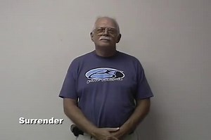 Watch how to sign 'surrender' in American Sign Language.