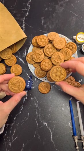 Miriam's Kitchen on Instagram: "✨ Hanukkah Gelt Cookies — homemade with so much love ✨ This year, I wanted to bring a little extra magic to our Hanukkah treats… so I made these sweet gelt-inspired cookies using our own cookie cutters — the ones you see right here in the video. 🕎⭐️ There’s something so special about pressing the dough and watching these tiny Hanukkah symbols appear… it instantly fills the kitchen with holiday warmth. Fresh cookies, golden edges, and designs that make everyone sm