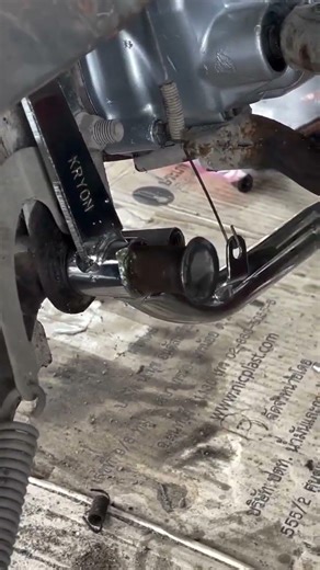 process of installing the rear brake support axle of a motorbike#shorts