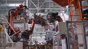 Automobile plant, robot equipment, welding process, modern production of cars, automated production line.