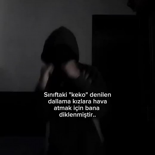Mysterious Hooded Performance in Dimly Lit Room