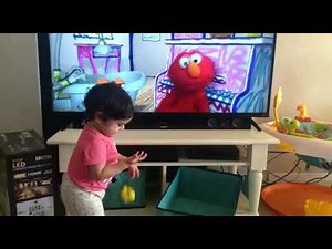 Baby watching Elmo's world.