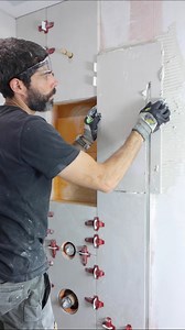 Vertical tile shower wall tips…I use the wet saw and grinder to cut around my shower glass u-channel. Any chipping can be addressed with a 200 or 400 grit polishing pad. The most important step is getting full mortar coverage. I shoot for at least 95% coverage. The tile leveling system helps keep everything flat at the edges 👍🏽🔥#tile #tileshower #bathroomremodel #homerenovationideas | Home Repair Tutor