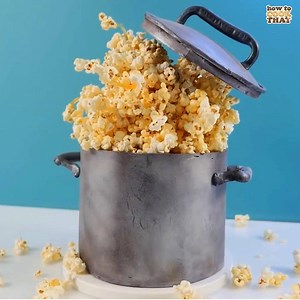 This Popcorn Cake features layers of cream, salted caramel and rich chocolate cake with the realistic looking pot made out of chocolate. We've designed this fun Gravity Defying cake to have popcorn exploding out of the pot for added effect. This cake is perfect for any Hollywood themed event or a family movie night at home. | Ann Reardon How To Cook That