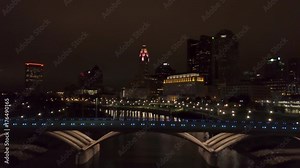 night flying over Rich Street Bridge towards downtown Columbus Ohio skyline
